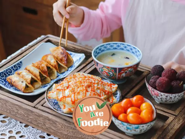 Fancy breakfast: pork potstickers, potato egg cakes, pumpkin millet porridge