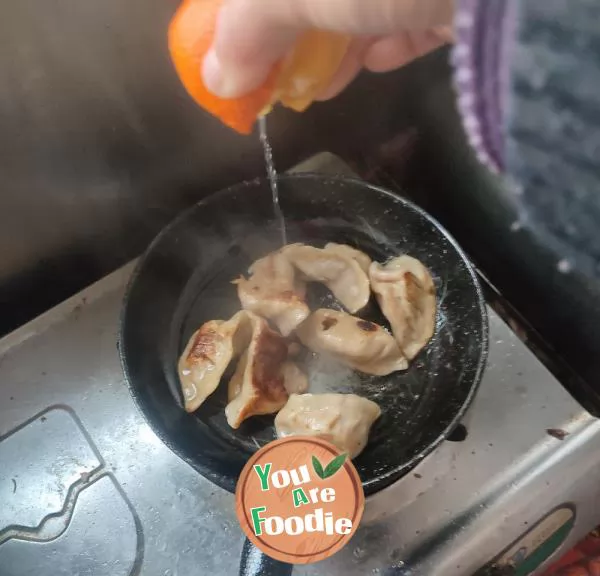 Fried dumplings with orange juice