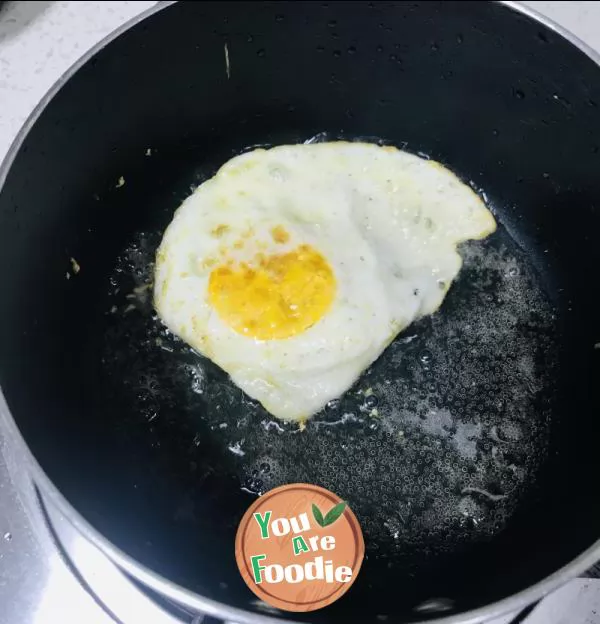 Fried egg with tomato sauce