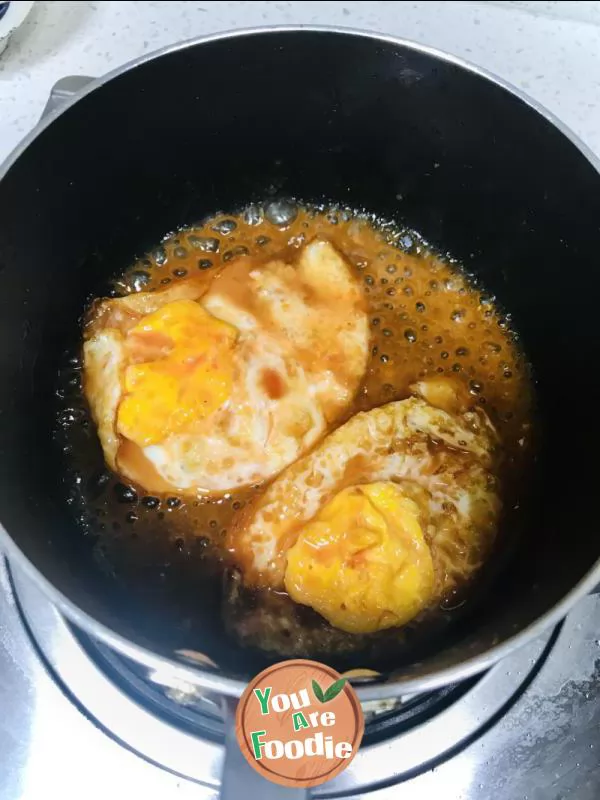 Fried egg with tomato sauce