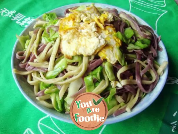 Fried colorful noodles with eggs