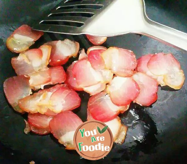 Preserved pork with garlic stalk