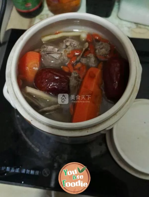 Stewed pigeon soup in electric pottery pot