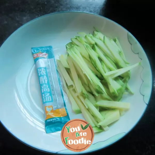 Boiled noodles with pumpkin shreds in broth