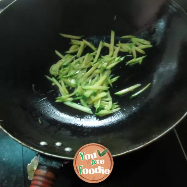 Boiled noodles with pumpkin shreds in broth