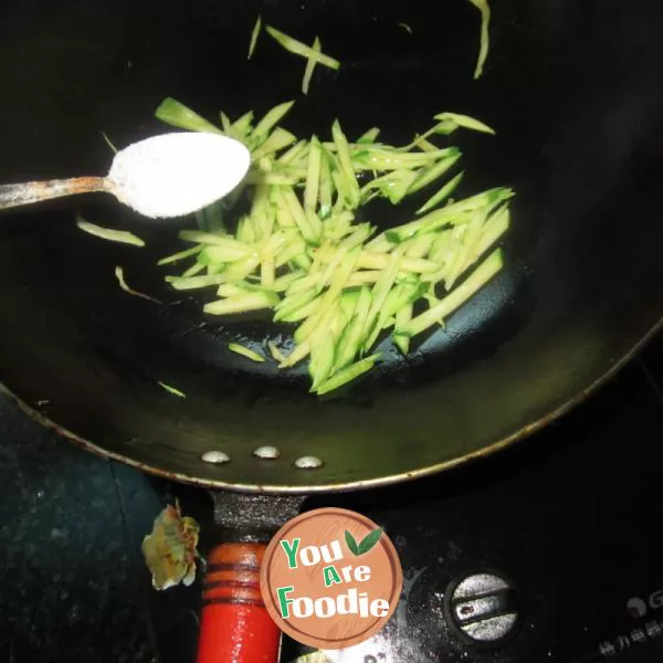 Boiled noodles with pumpkin shreds in broth