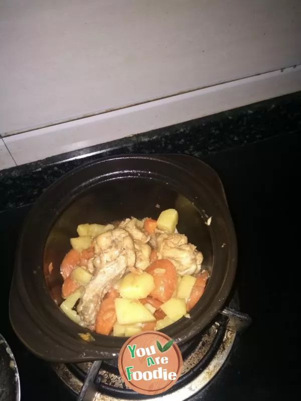 Stewed chicken legs, potatoes and carrots