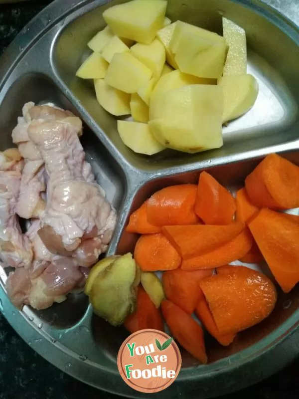 Stewed chicken legs, potatoes and carrots