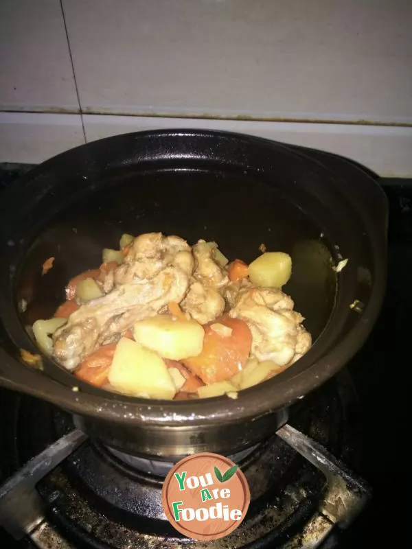 Stewed chicken legs, potatoes and carrots