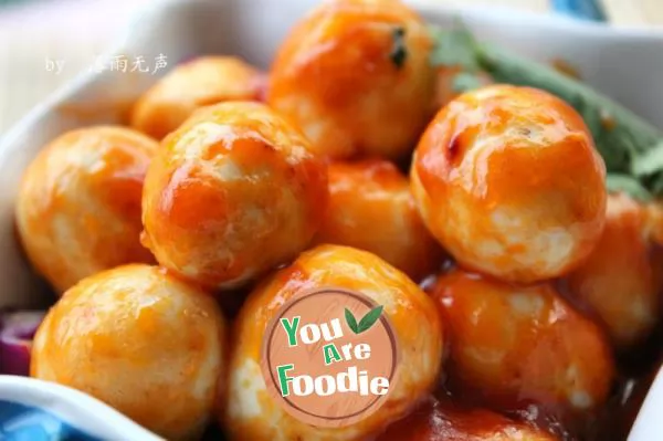 Quail eggs in tomato sauce