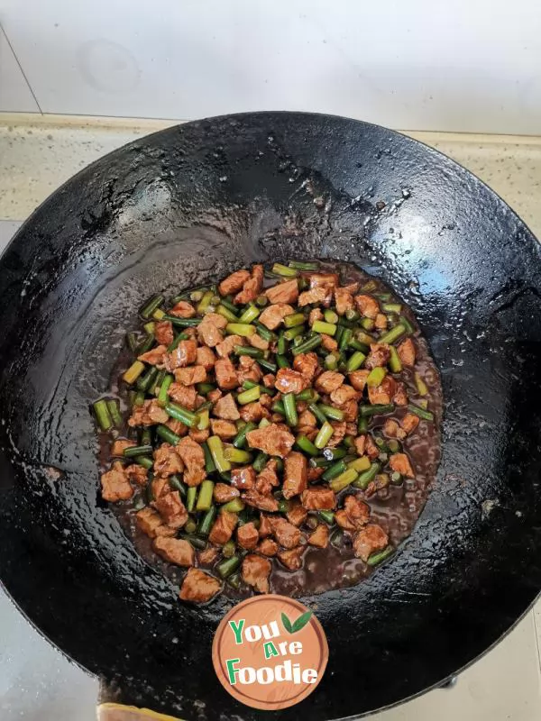 Stir fried pork with garlic sprouts