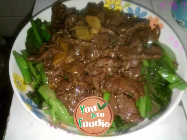 Fried beef with mustard in oyster sauce