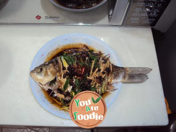 Steamed fish with scallion and bean in microwave oven