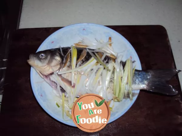 Steamed fish with scallion and bean in microwave oven