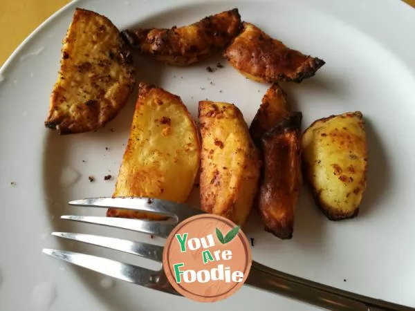 Homemade snack - baked potato with pepper and salt