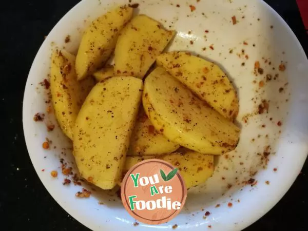 Homemade snack - baked potato with pepper and salt