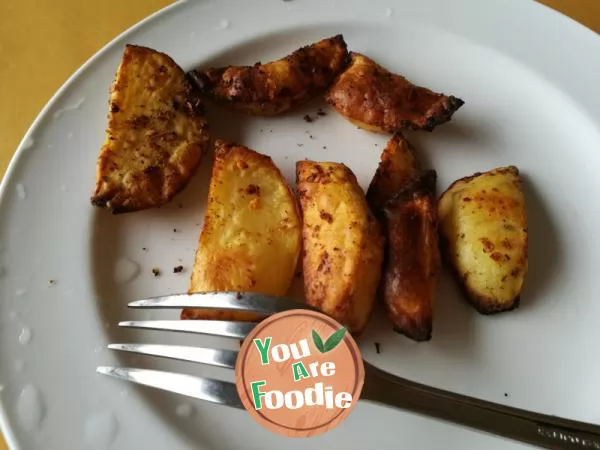 Homemade snack - baked potato with pepper and salt