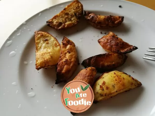 Homemade snack - baked potato with pepper and salt