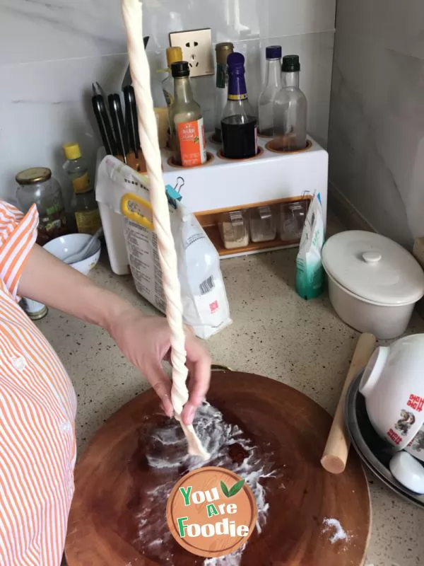 Hand grasping cake crust