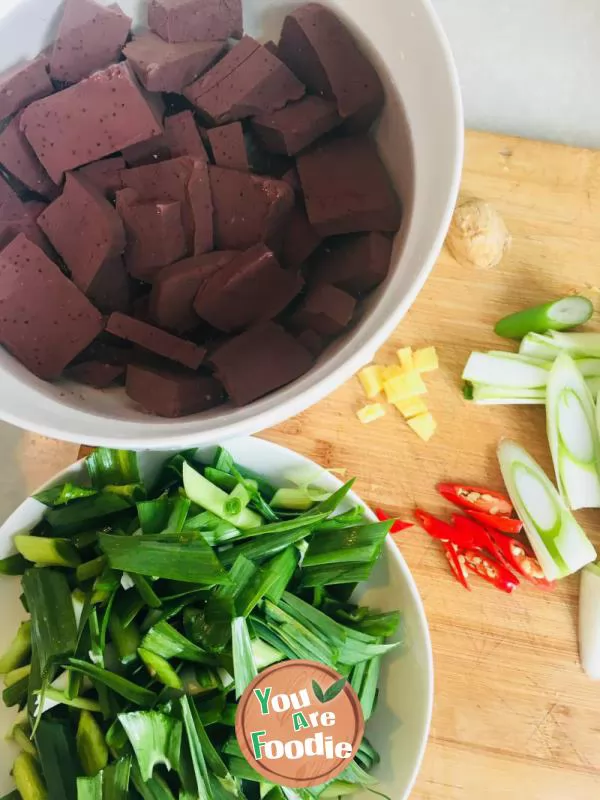 Fried duck blood with garlic sprouts