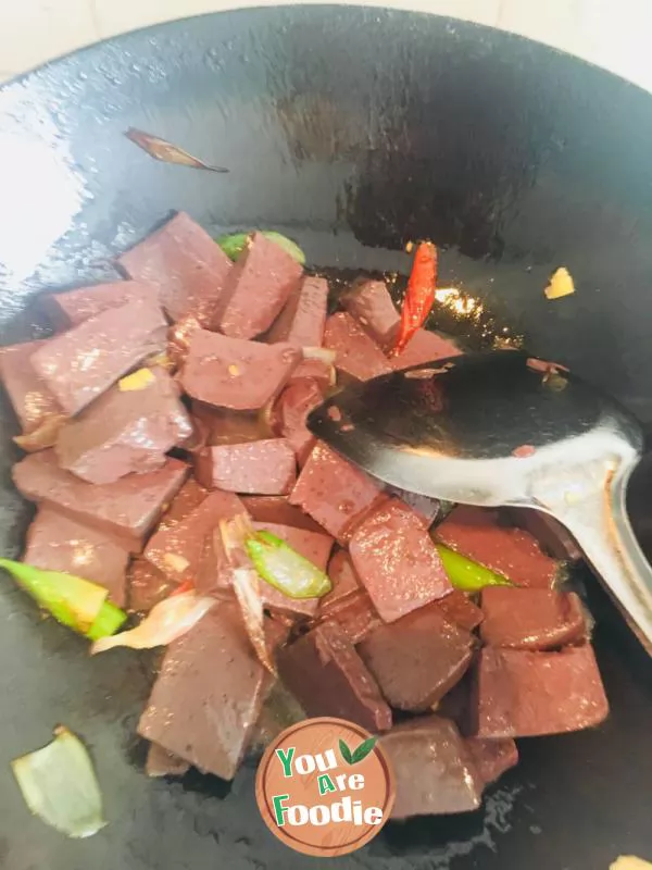 Fried duck blood with garlic sprouts