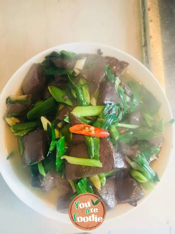 Fried duck blood with garlic sprouts