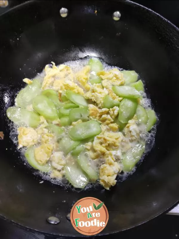 Fried egg with towel gourd