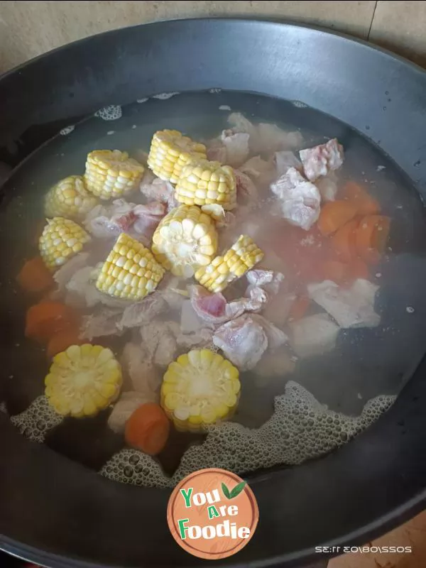 Pork ribs, carrots and corn soup
