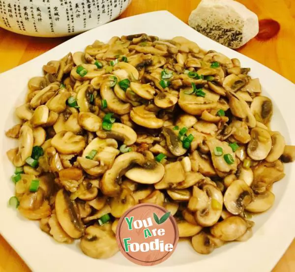 Fried pork with Agaricus bisporus