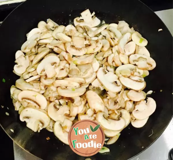 Fried pork with Agaricus bisporus