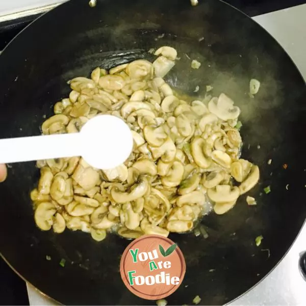 Fried pork with Agaricus bisporus