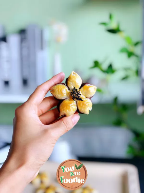 Hand Grasping Cake with Peach Blossom Crisp