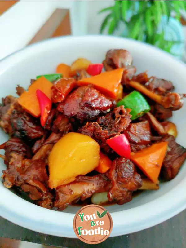 Braised duck legs with potatoes and carrots