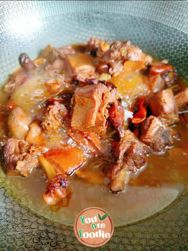 Braised duck legs with potatoes and carrots