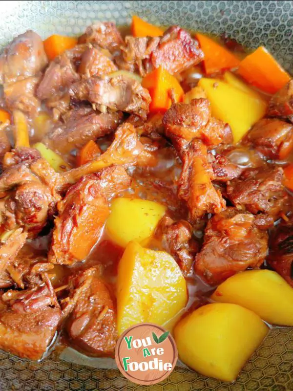 Braised duck legs with potatoes and carrots