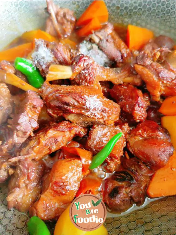 Braised duck legs with potatoes and carrots