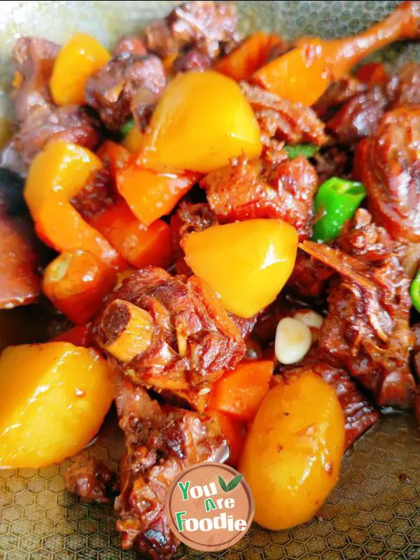 Braised duck legs with potatoes and carrots