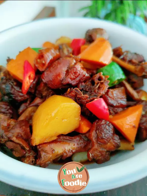 Braised duck legs with potatoes and carrots