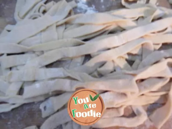 Hand rolling egg noodles