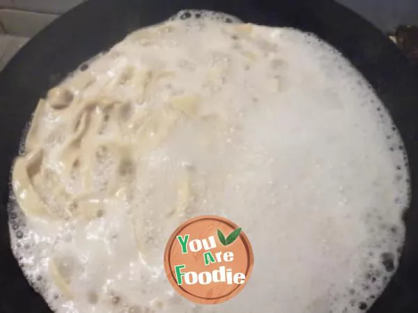 Hand rolling egg noodles