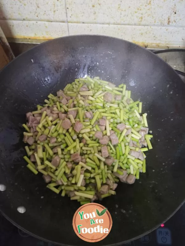 Stir fried pork with garlic sprouts