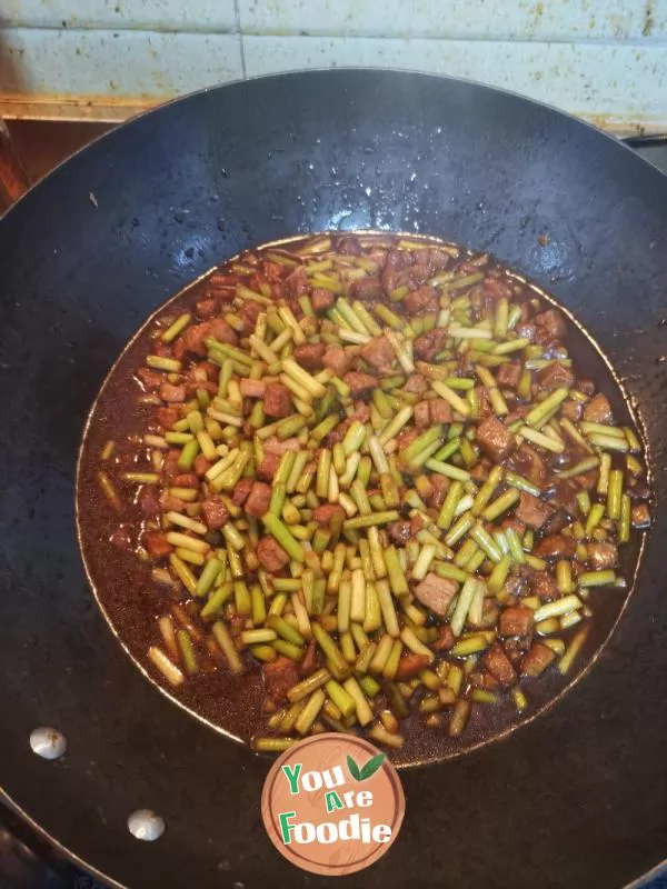 Stir fried pork with garlic sprouts