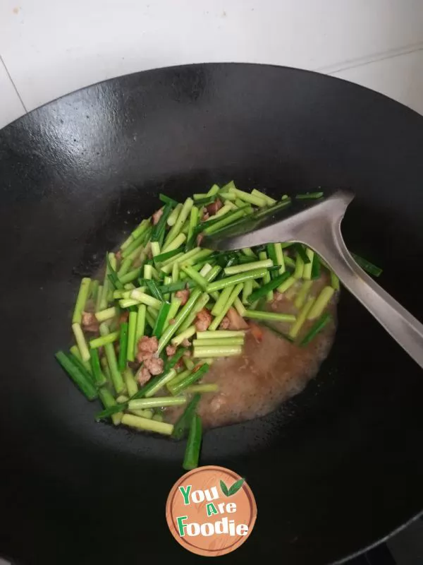 Stir fried garlic sprouts with minced meat