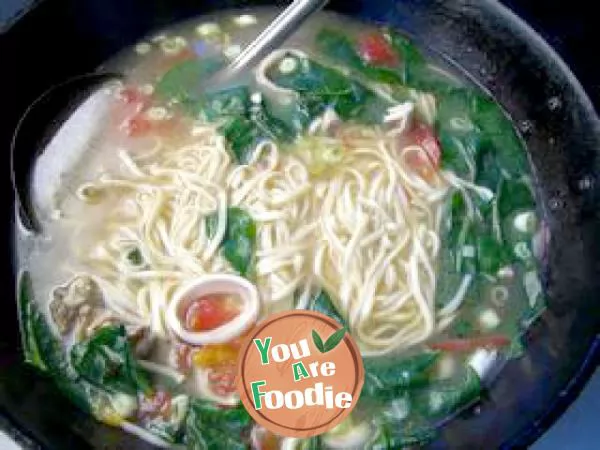 Squid noodles in chicken soup