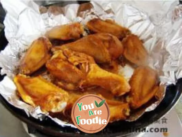 Fried chicken wings and legs with tin foil