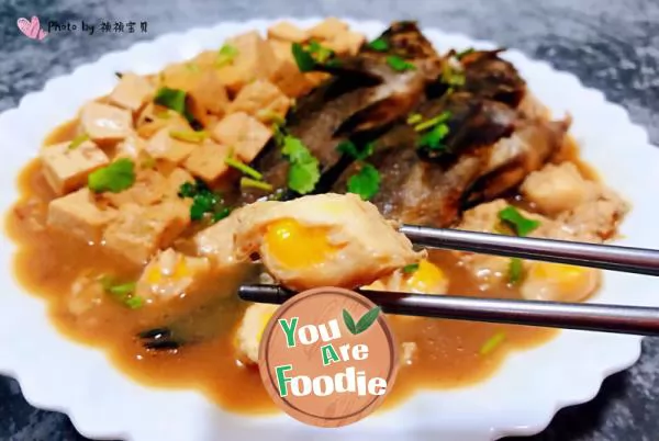 Stewed black fish with quail eggs and tofu