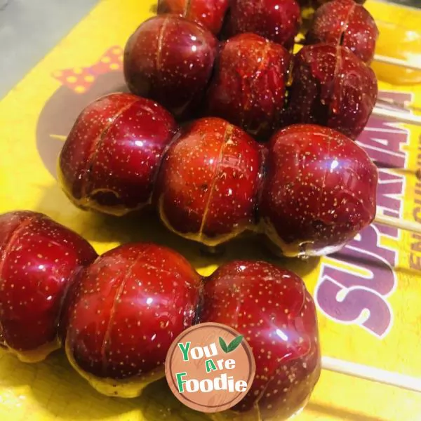 candied gourd on a stick