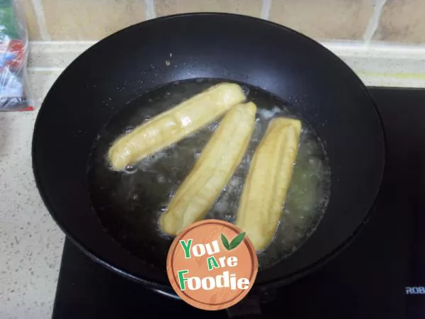 Fried egg pancake with fried dough sticks