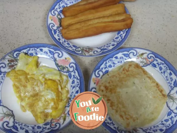 Fried egg pancake with fried dough sticks