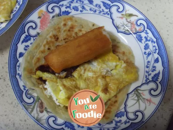 Fried egg pancake with fried dough sticks